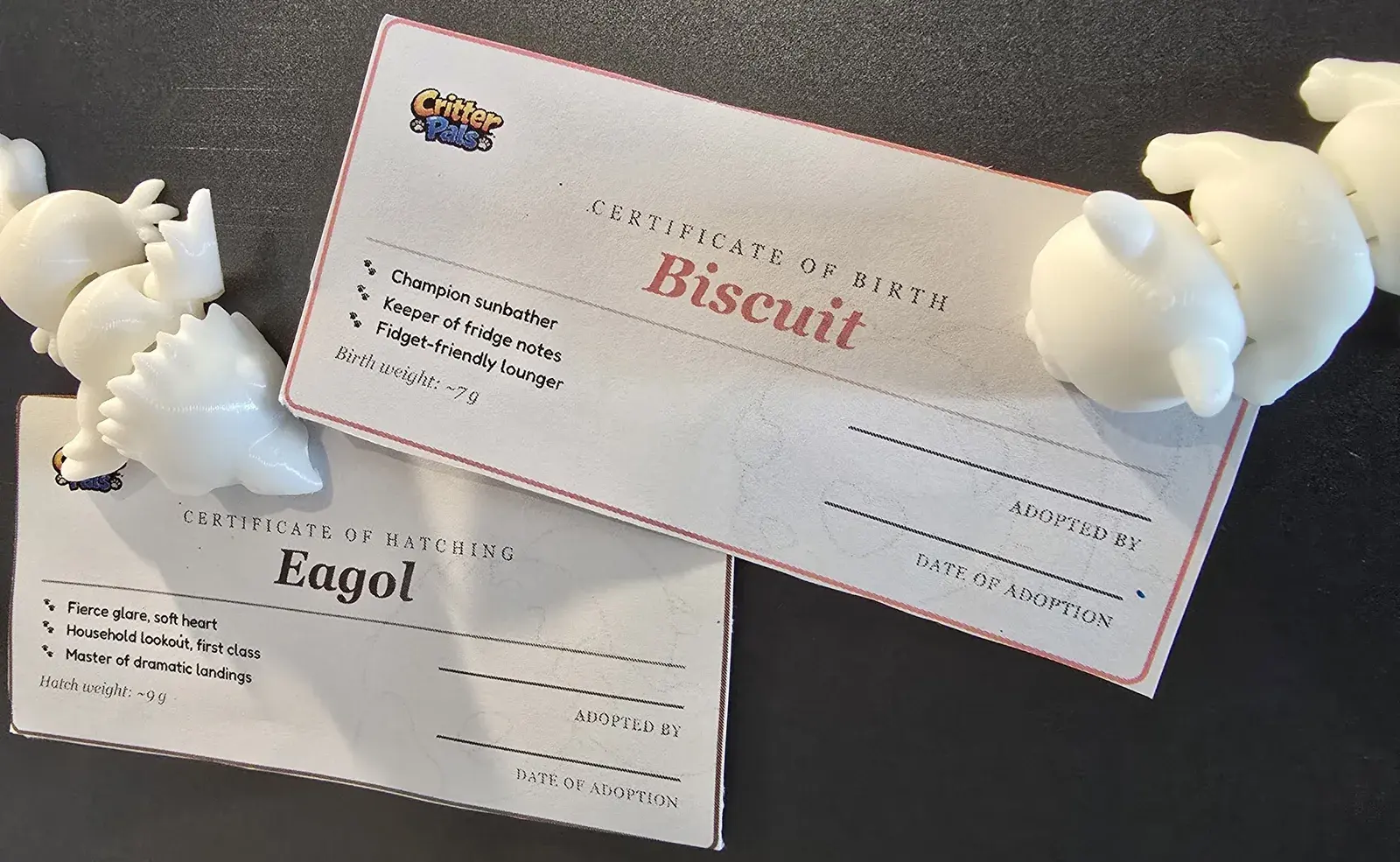 CritterPals magnets beside their printed birth certificates